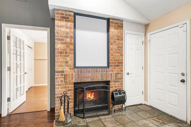 a room with a fireplace and a window