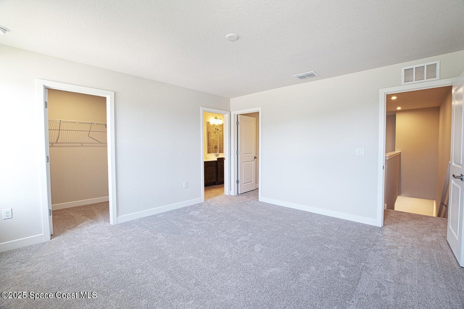 1865 Kendall Pointe Place Melbourne, FL 32935 - Photo 5 of 15 a view of an empty room with closet and a window