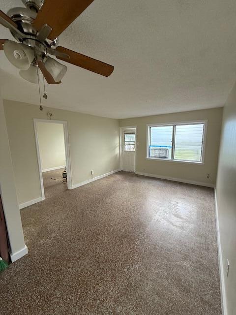 116 Mayfield Road, Unit 3 Lantana, FL 33462 - Photo 2 of 8 an empty room with windows and fan