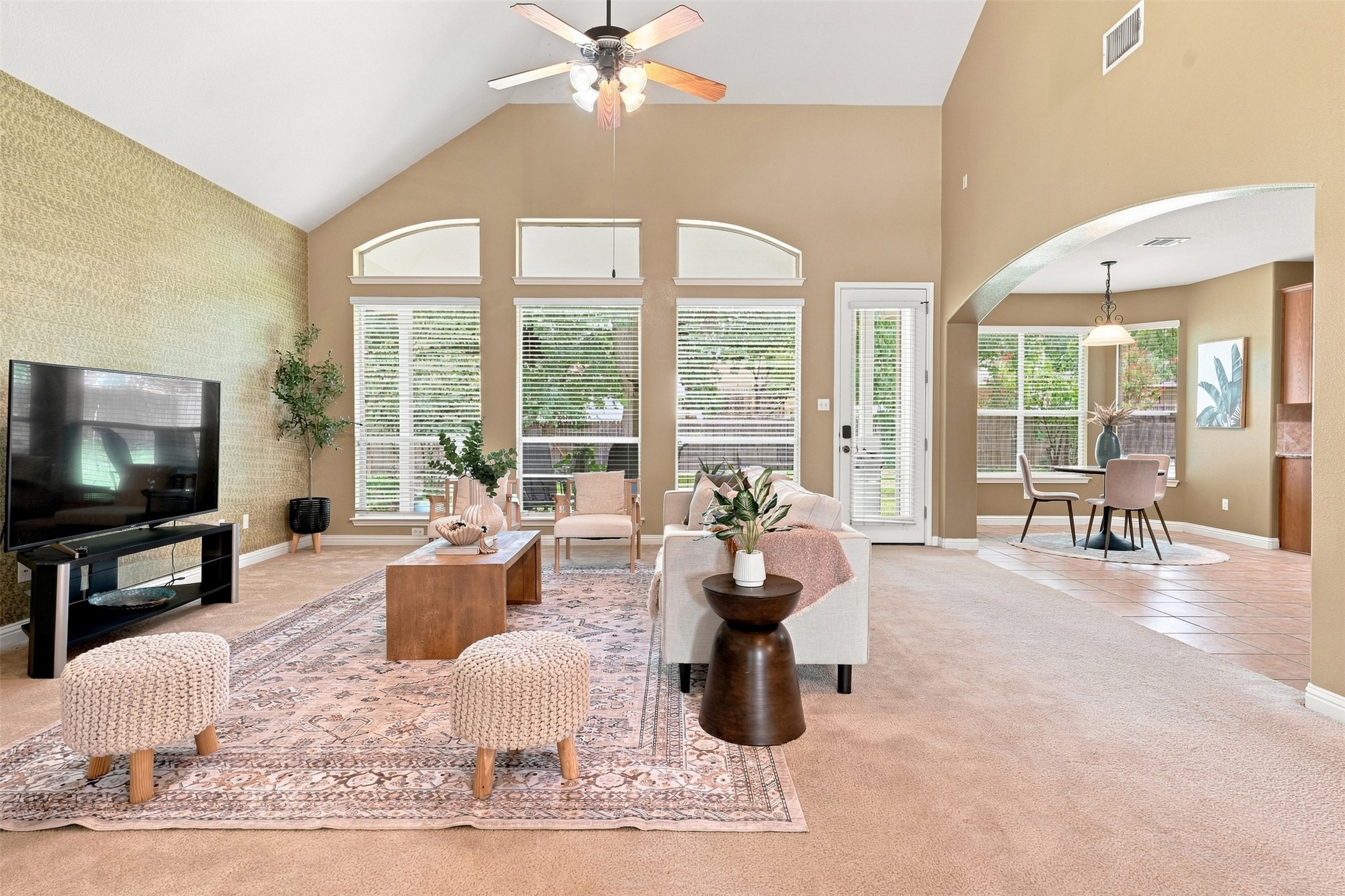 1116 Canyon Maple Road Pflugerville, TX 78660 - Photo 10 of 32 High vaulted ceilings and arched entries define this open living area with abundant natural light.