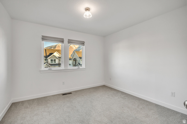 1058 Lilac Way Mapleton, UT 84664 - Photo 16 of 28 Unfurnished room featuring baseboards and light colored carpet