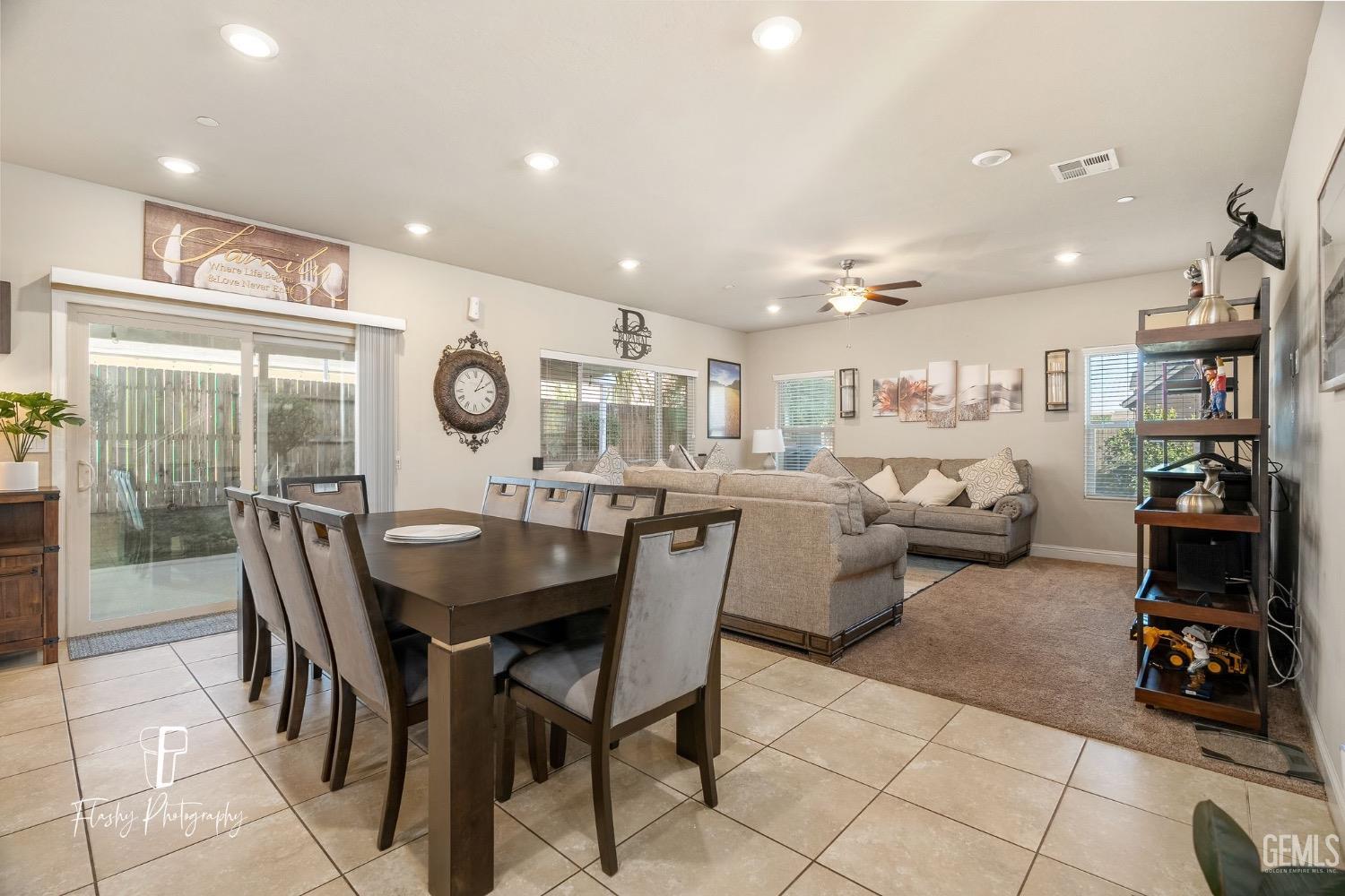 Undisclosed Address Bakersfield, CA 93313 - Photo 13 of 36 a very nice looking open dining room with kitchen island and a view of living room