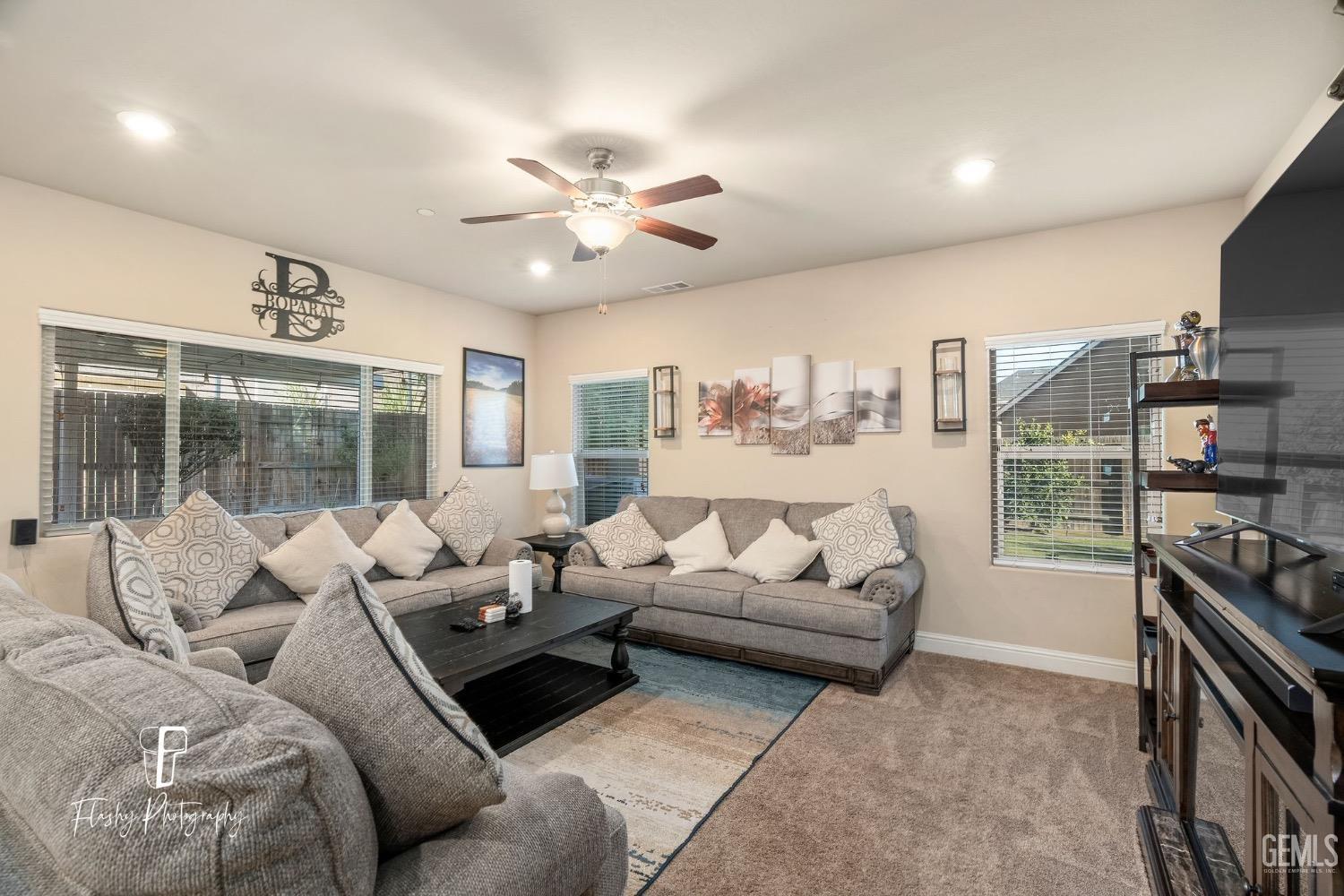 Undisclosed Address Bakersfield, CA 93313 - Photo 19 of 36 a living room with furniture and a large window