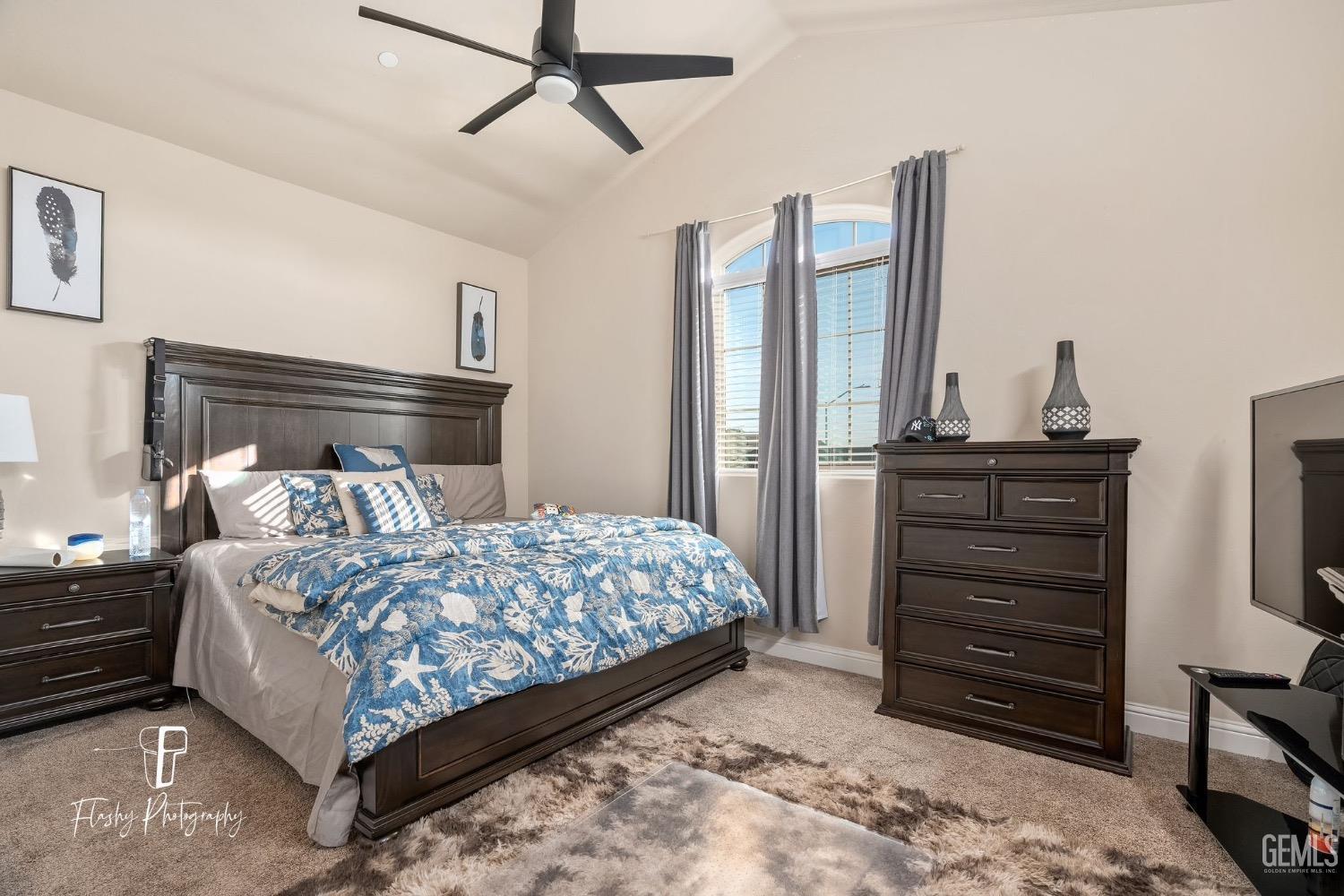 Undisclosed Address Bakersfield, CA 93313 - Photo 22 of 36 a bedroom with a bed and a dresser