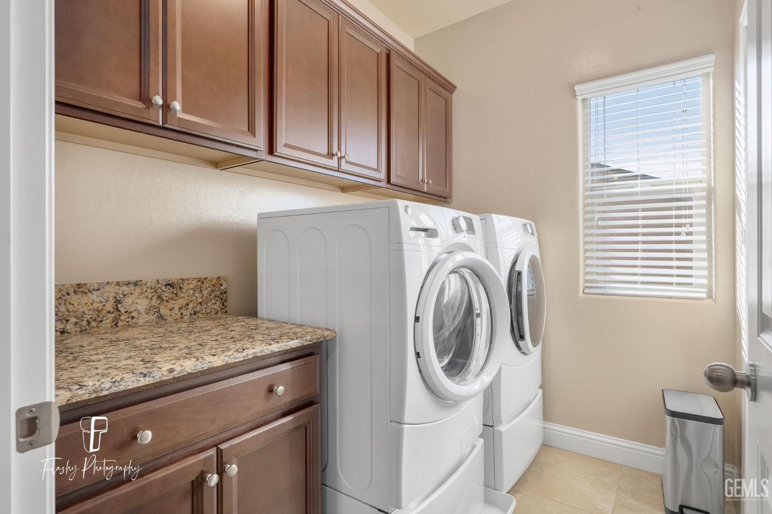Undisclosed Address Bakersfield, CA 93313 - Photo 24 of 36 a utility room with dryer and washer