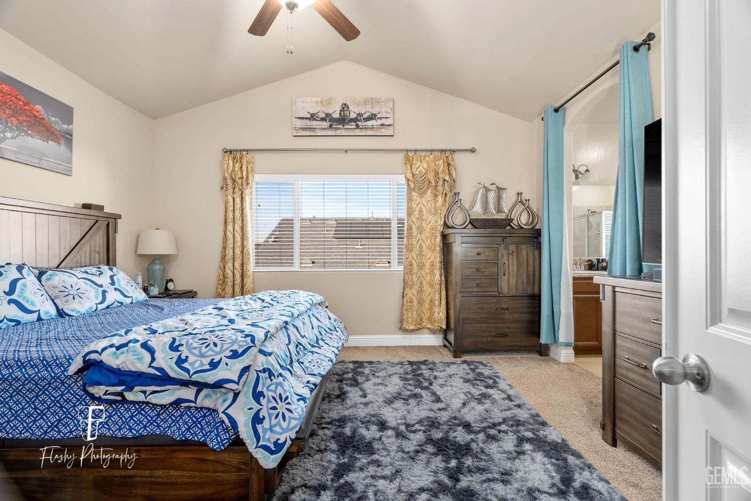 Undisclosed Address Bakersfield, CA 93313 - Photo 27 of 36 a bedroom with a bed dresser and a window