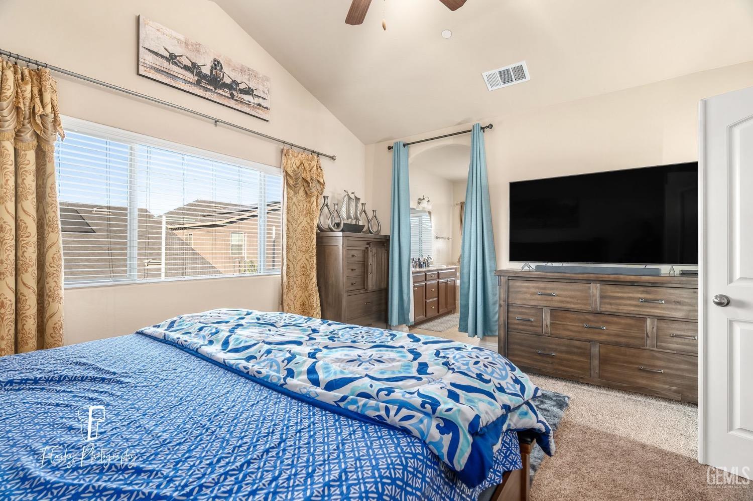 Undisclosed Address Bakersfield, CA 93313 - Photo 29 of 36 a bedroom with a bed and a flat screen tv