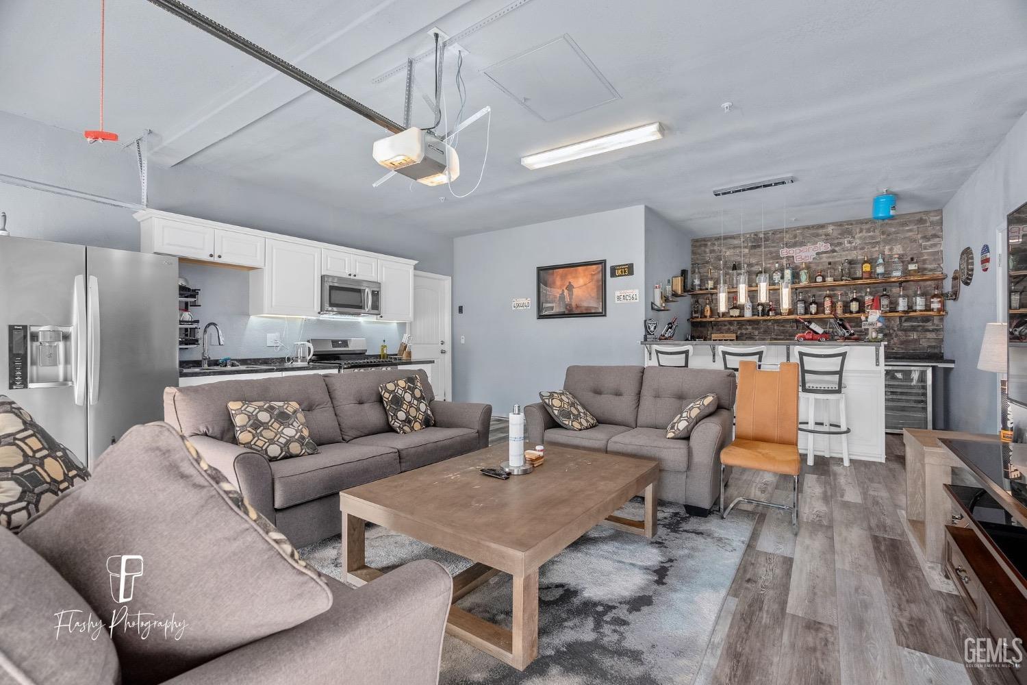 Undisclosed Address Bakersfield, CA 93313 - Photo 3 of 36 a living room with furniture and kitchen view