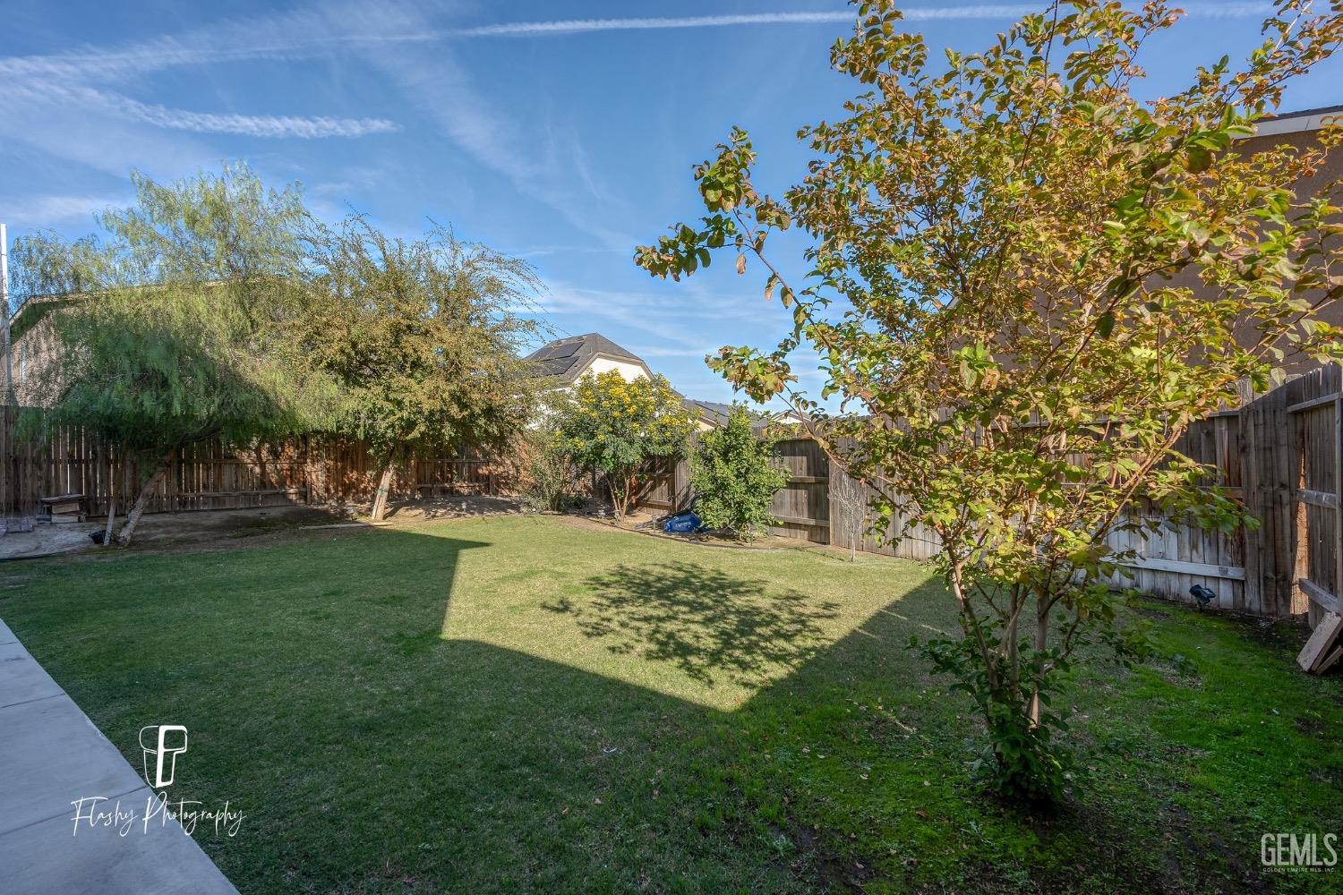 Undisclosed Address Bakersfield, CA 93313 - Photo 34 of 36 a view of a backyard with large trees