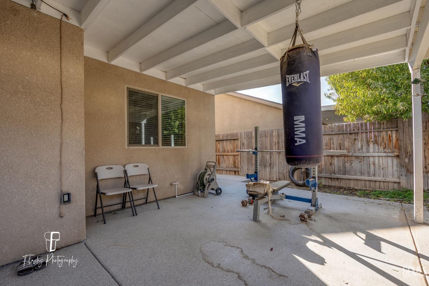 Undisclosed Address Bakersfield, CA 93313 - Photo 36 of 36 a living room with furniture and a window