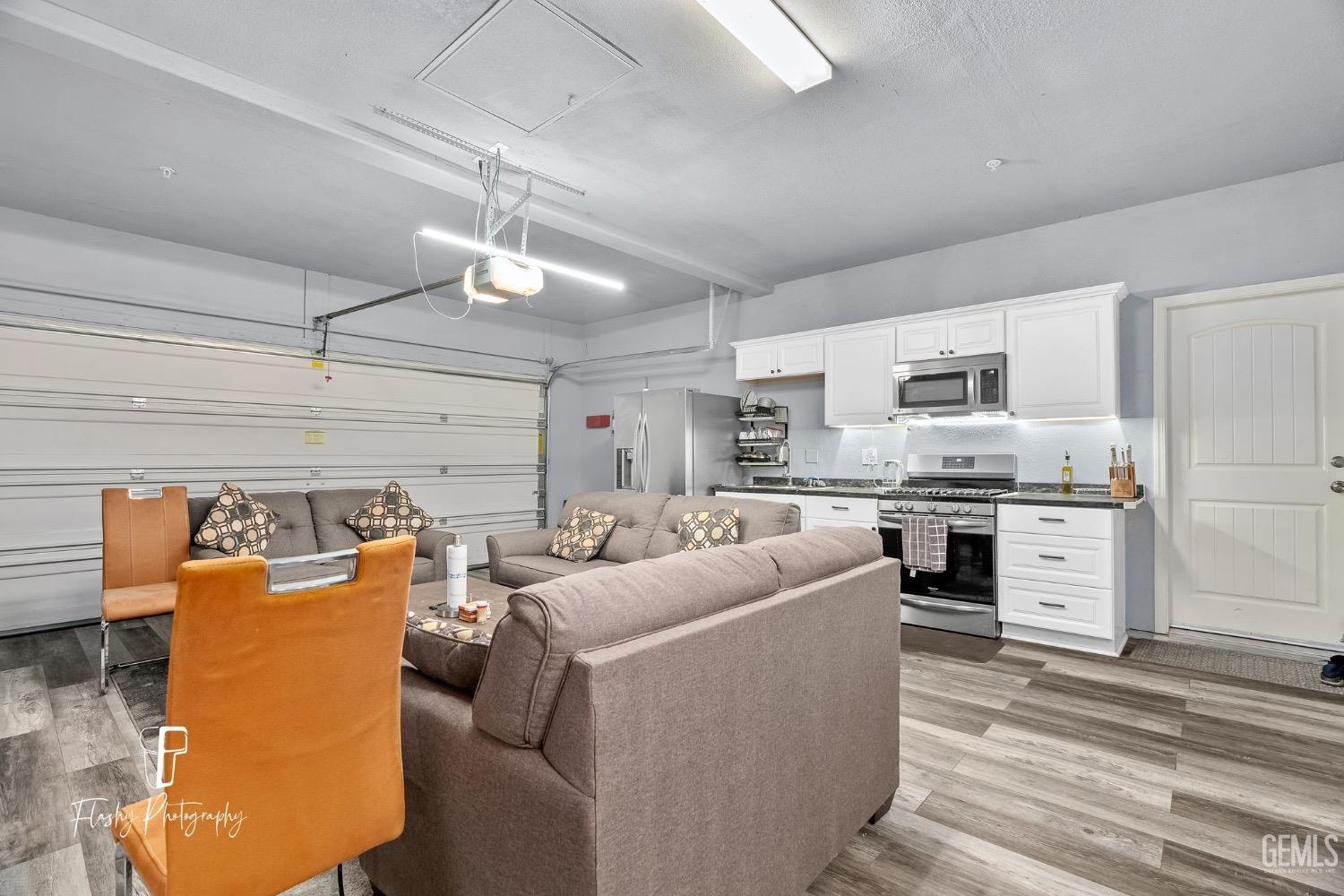 Undisclosed Address Bakersfield, CA 93313 - Photo 4 of 36 a living room with furniture and kitchen view