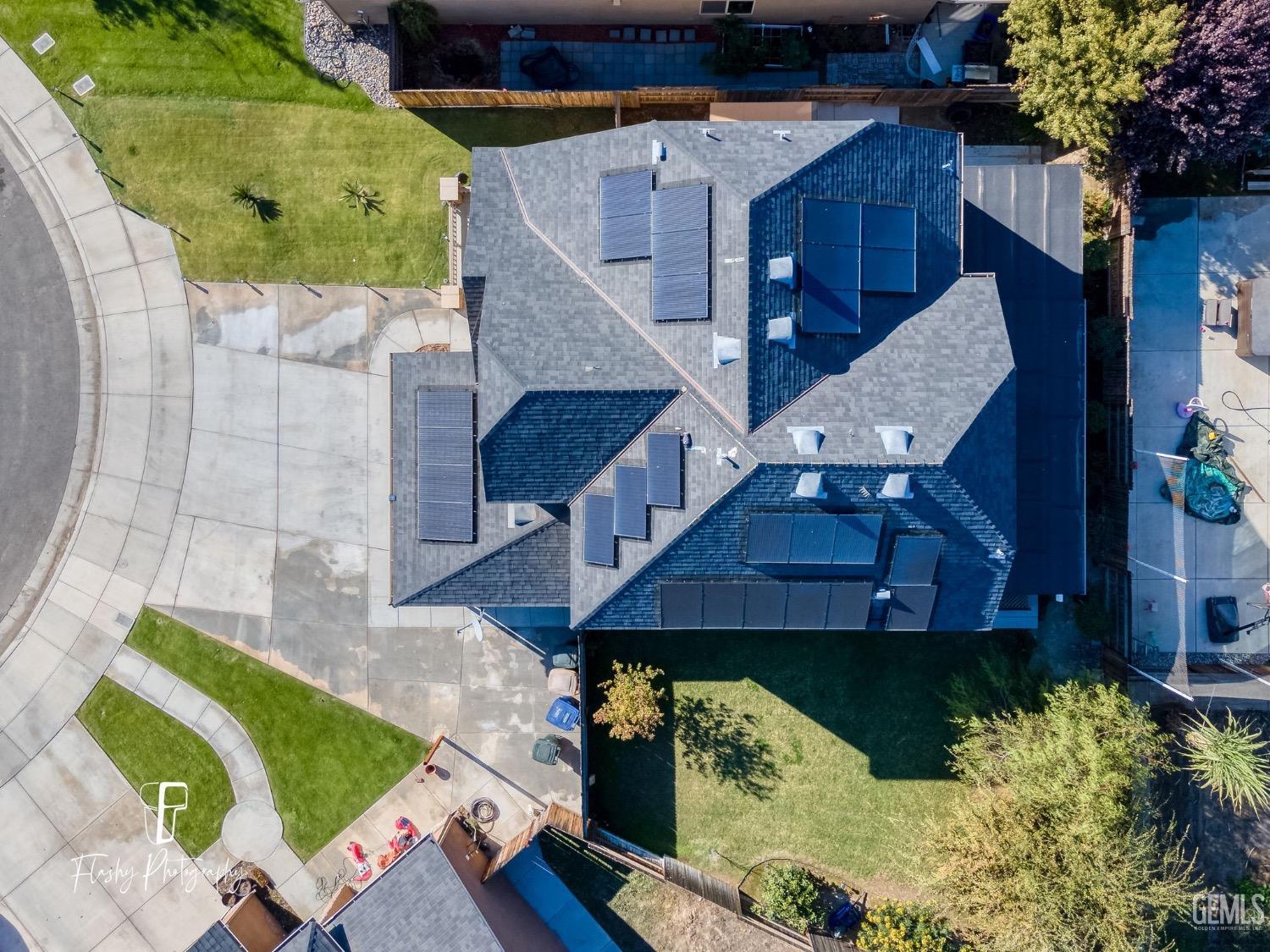 Undisclosed Address Bakersfield, CA 93313 - Photo 6 of 36 an aerial view of a house with a yard and balcony