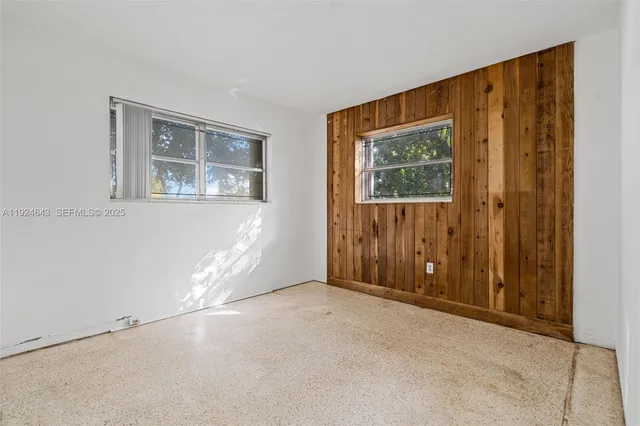 a view of an empty room with a closet