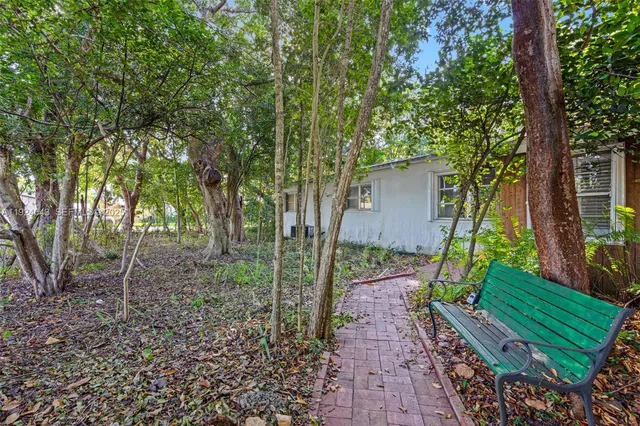a backyard of a house with lots of green space