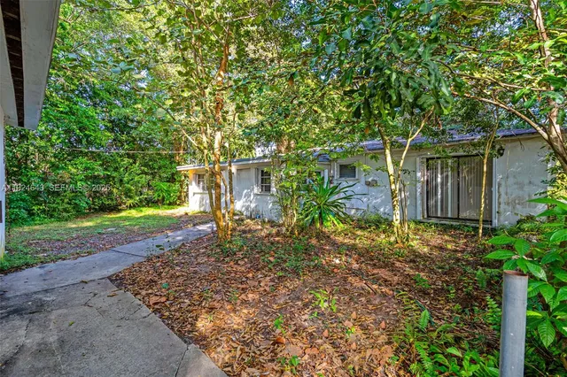 a backyard of a house with lots of green space