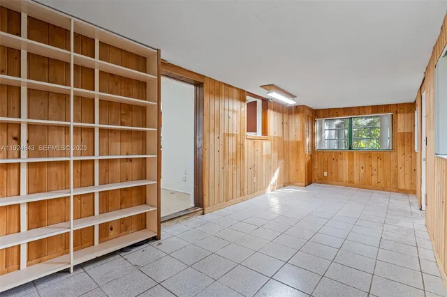 a kitchen that has a sink and a stove