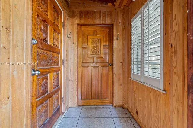 a view of an empty room with a cabinet and a cabinet