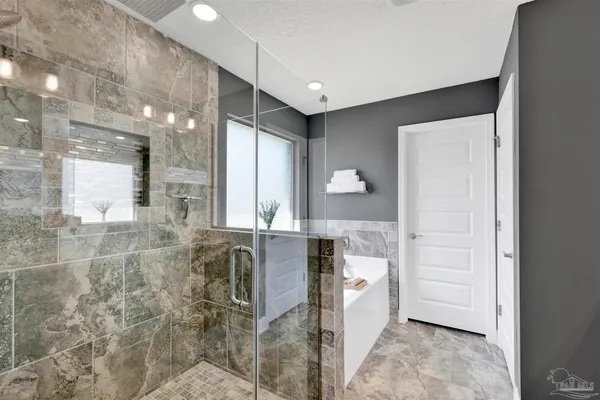 a bathroom with a bathtub and a sink