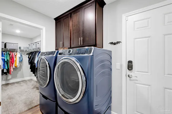 a utility room with dryer and washer