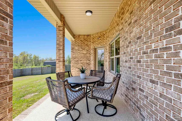 a patio with table and chairs
