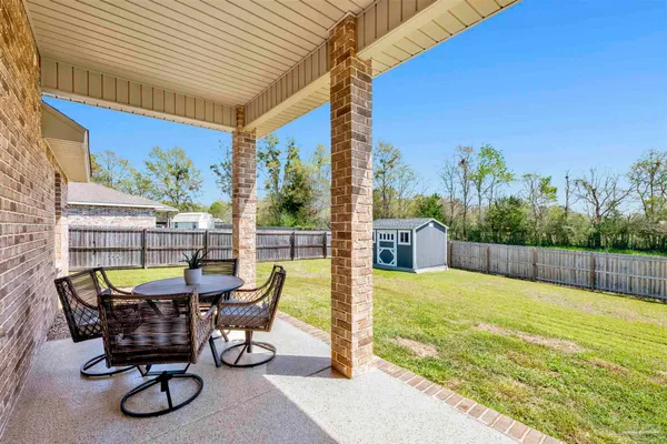 a view of swimming pool with patio