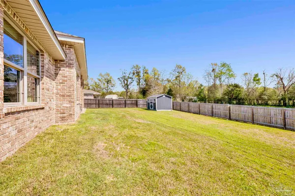 a view of a swimming pool with an outdoor space and seating area