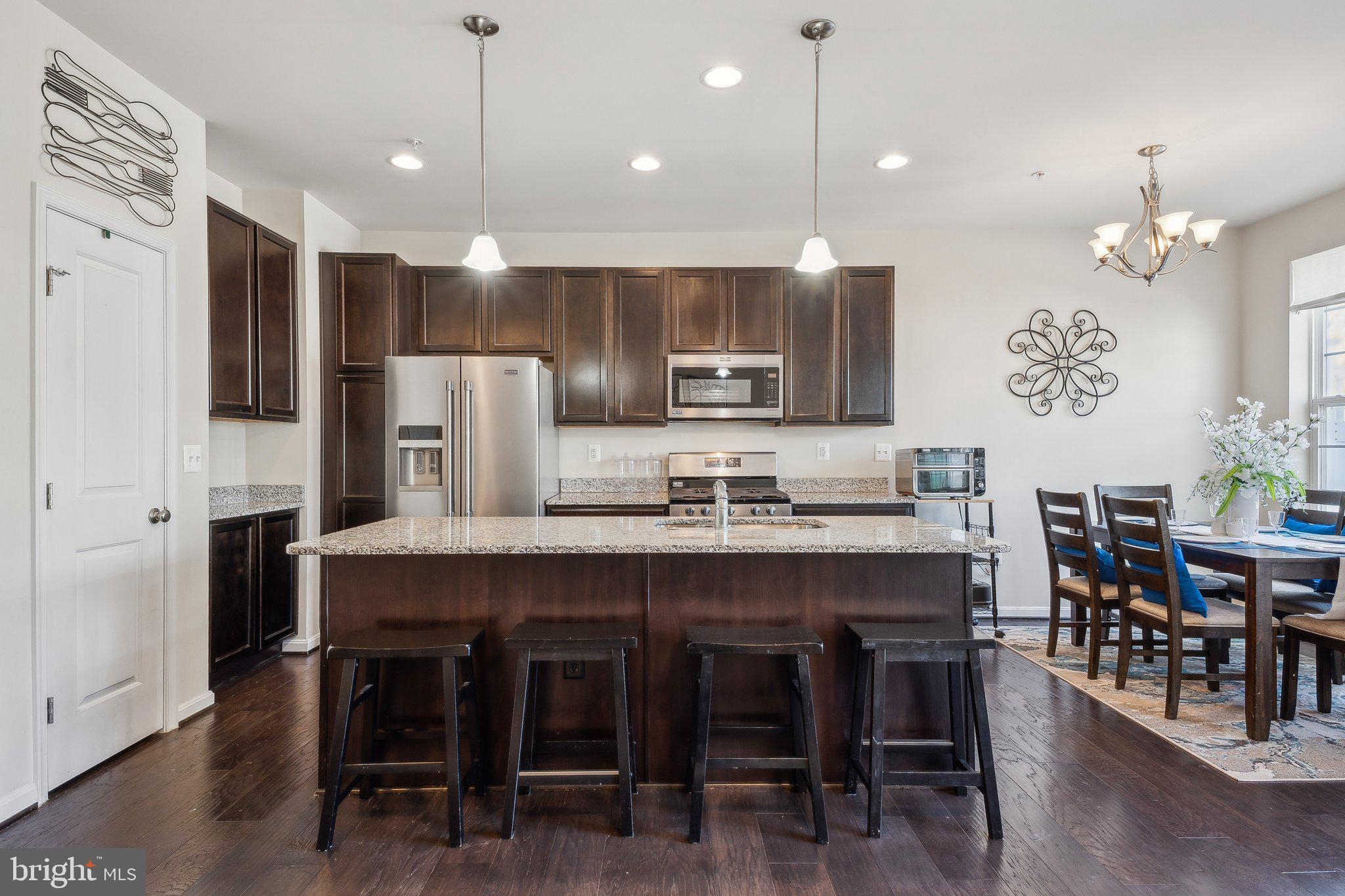 58 Mustang Drive La Plata, MD 20646 - Photo 16 of 42 a large kitchen with a table and chairs