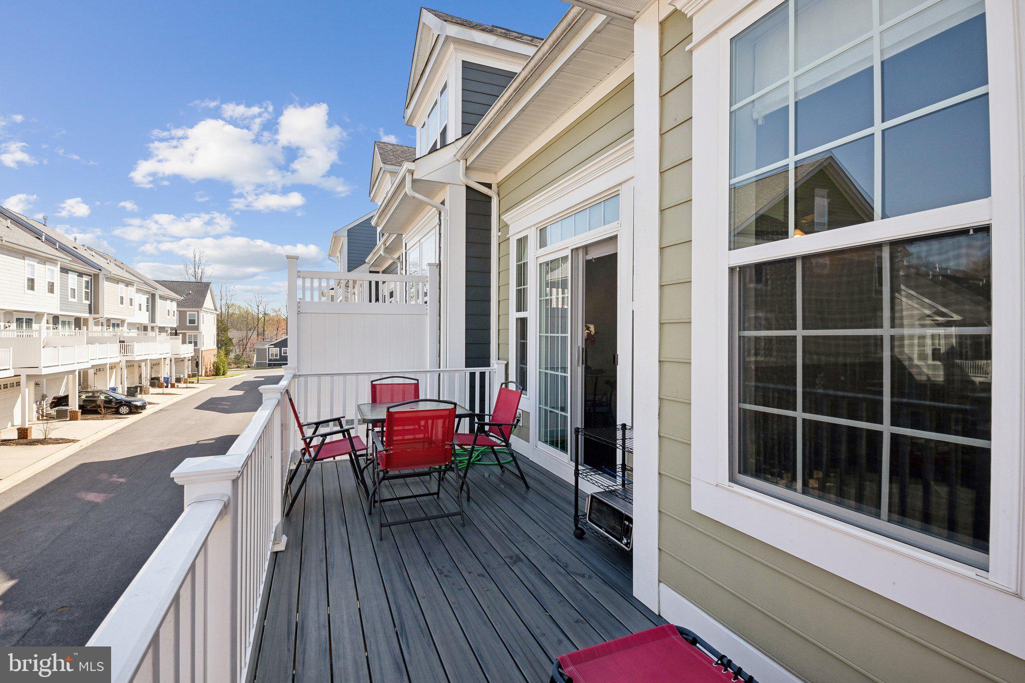 58 Mustang Drive La Plata, MD 20646 - Photo 19 of 42 a view of a balcony with chairs and wooden floor