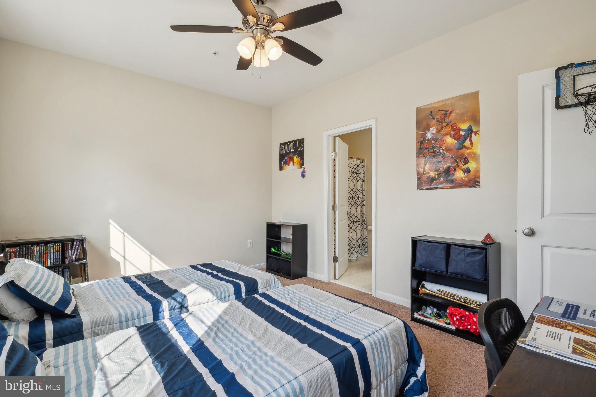 58 Mustang Drive La Plata, MD 20646 - Photo 24 of 42 a bedroom with a bed and a chandelier