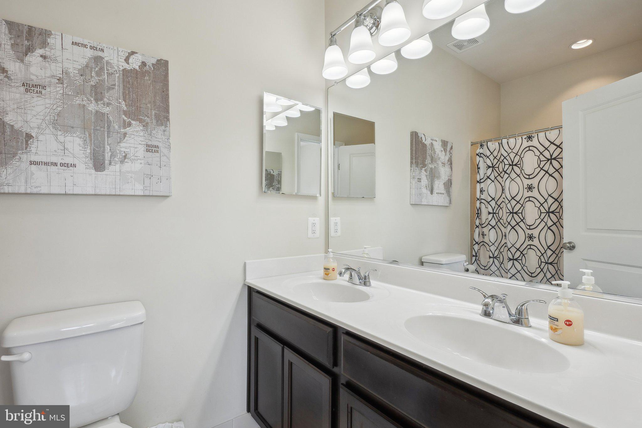 58 Mustang Drive La Plata, MD 20646 - Photo 25 of 42 a bathroom with a sink vanity and a mirror