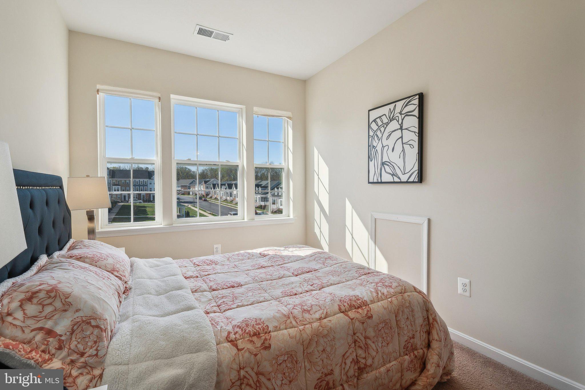 58 Mustang Drive La Plata, MD 20646 - Photo 28 of 42 a bed sitting in a bedroom next to a window