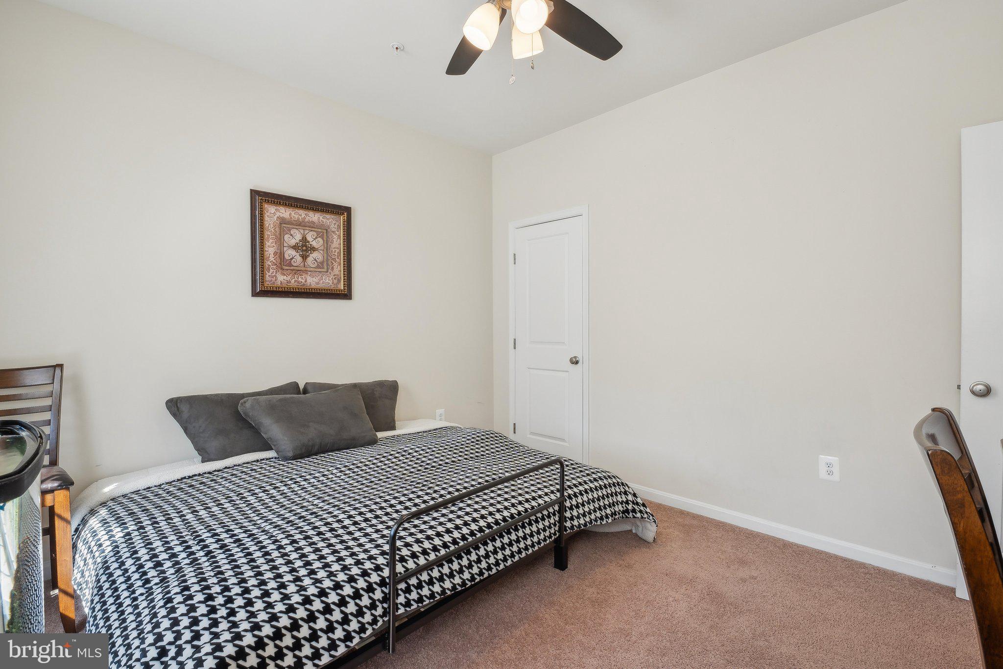 58 Mustang Drive La Plata, MD 20646 - Photo 5 of 42 a bedroom with a bed and a chandelier