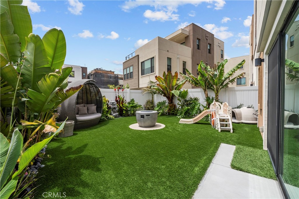 a view of a chair and table in front of a house