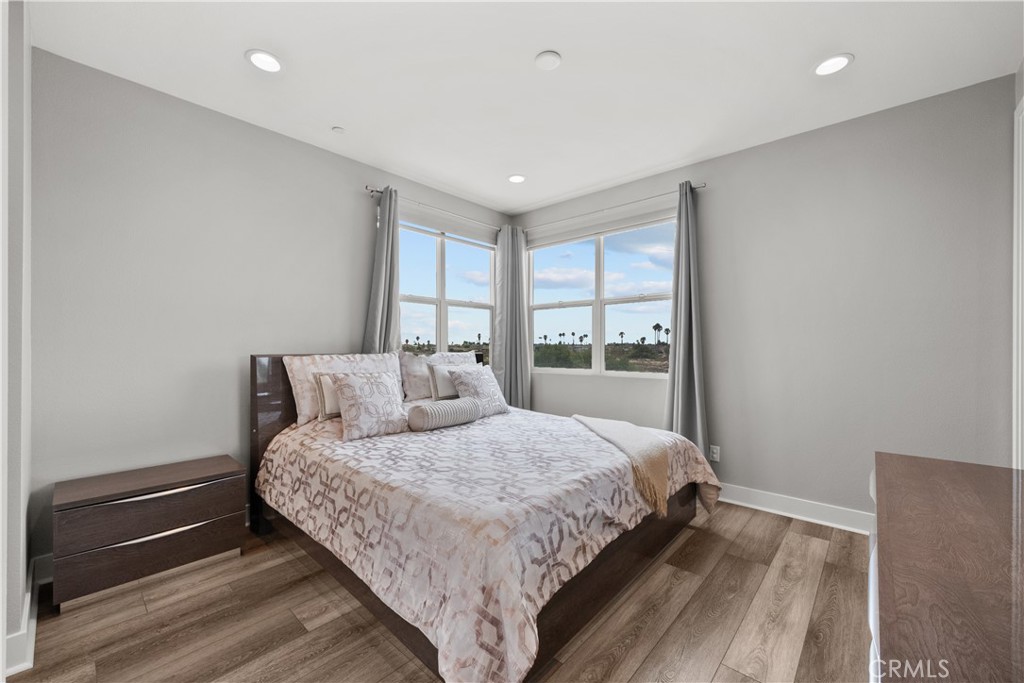 1068 Canal Street Oxnard, CA 93035 - Photo 18 of 36 a bedroom with a large bed and a window