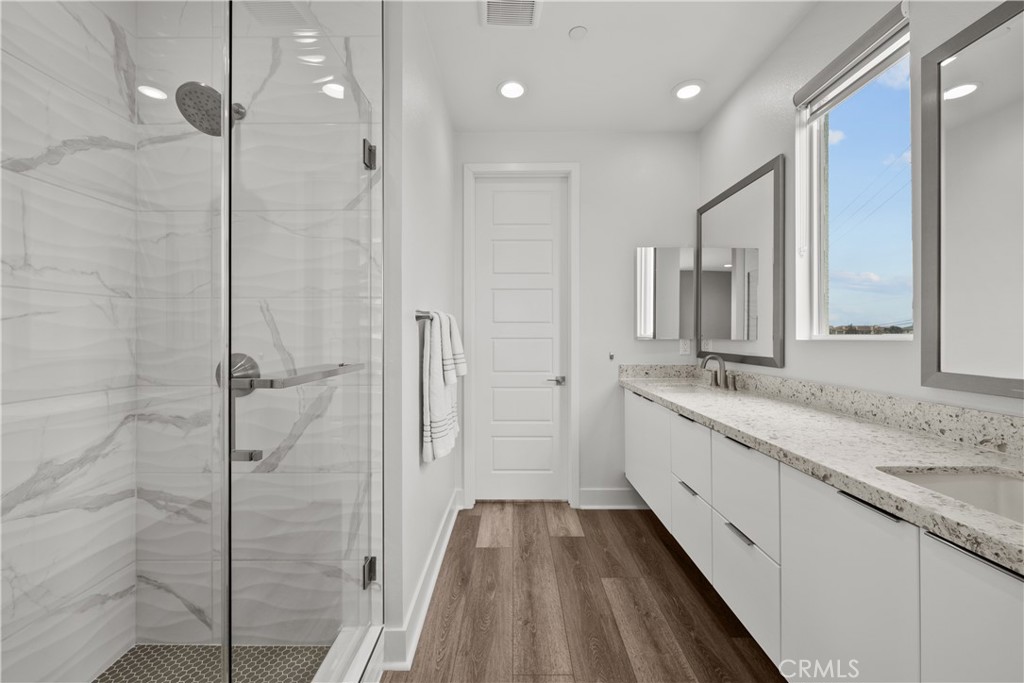 1068 Canal Street Oxnard, CA 93035 - Photo 20 of 36 a bathroom with a granite countertop sink mirror and double