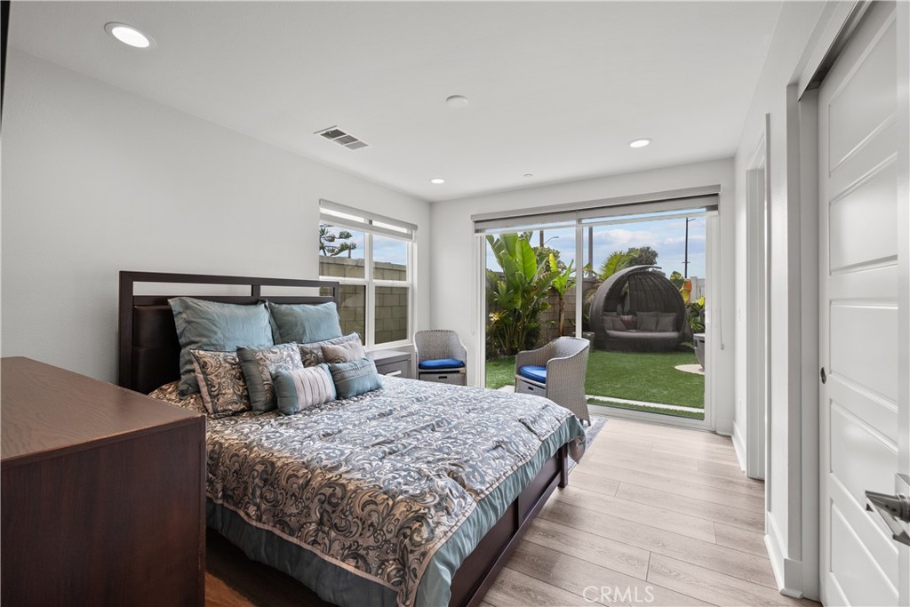 1068 Canal Street Oxnard, CA 93035 - Photo 23 of 36 a bedroom with a large bed and a large window