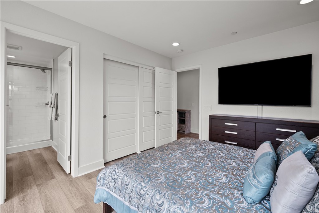 1068 Canal Street Oxnard, CA 93035 - Photo 24 of 36 a bedroom with a bed and a flat screen tv