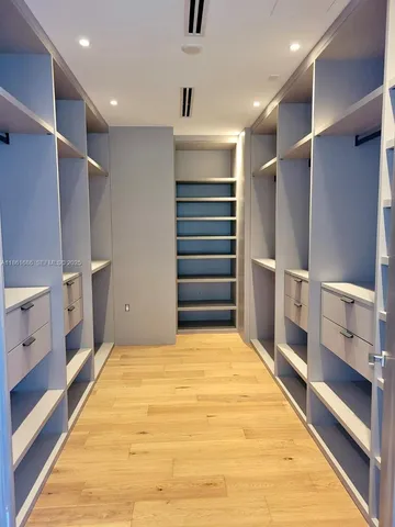 a view of an empty room with stairs