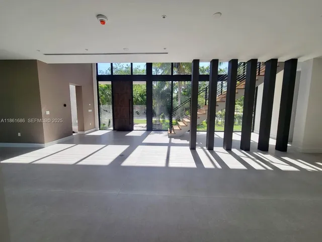 a view of a room with window and wooden floor