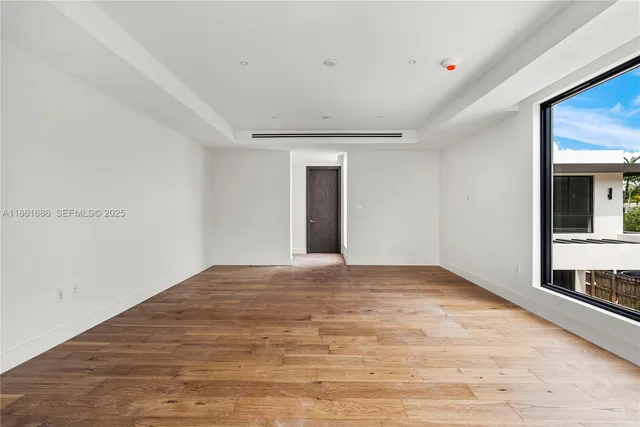 a view of a big room with sliding glass door