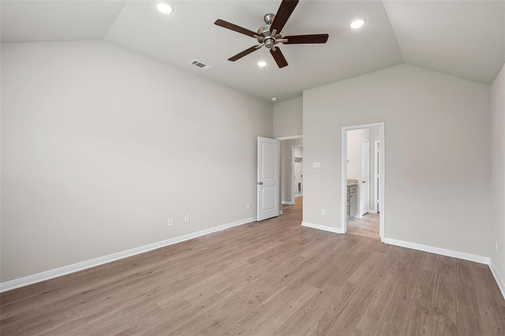 3224 Dottavio Road Lorena, TX 76655 - Photo 21 of 31 Spacious interior featuring a vaulted ceiling and wood-finish flooring