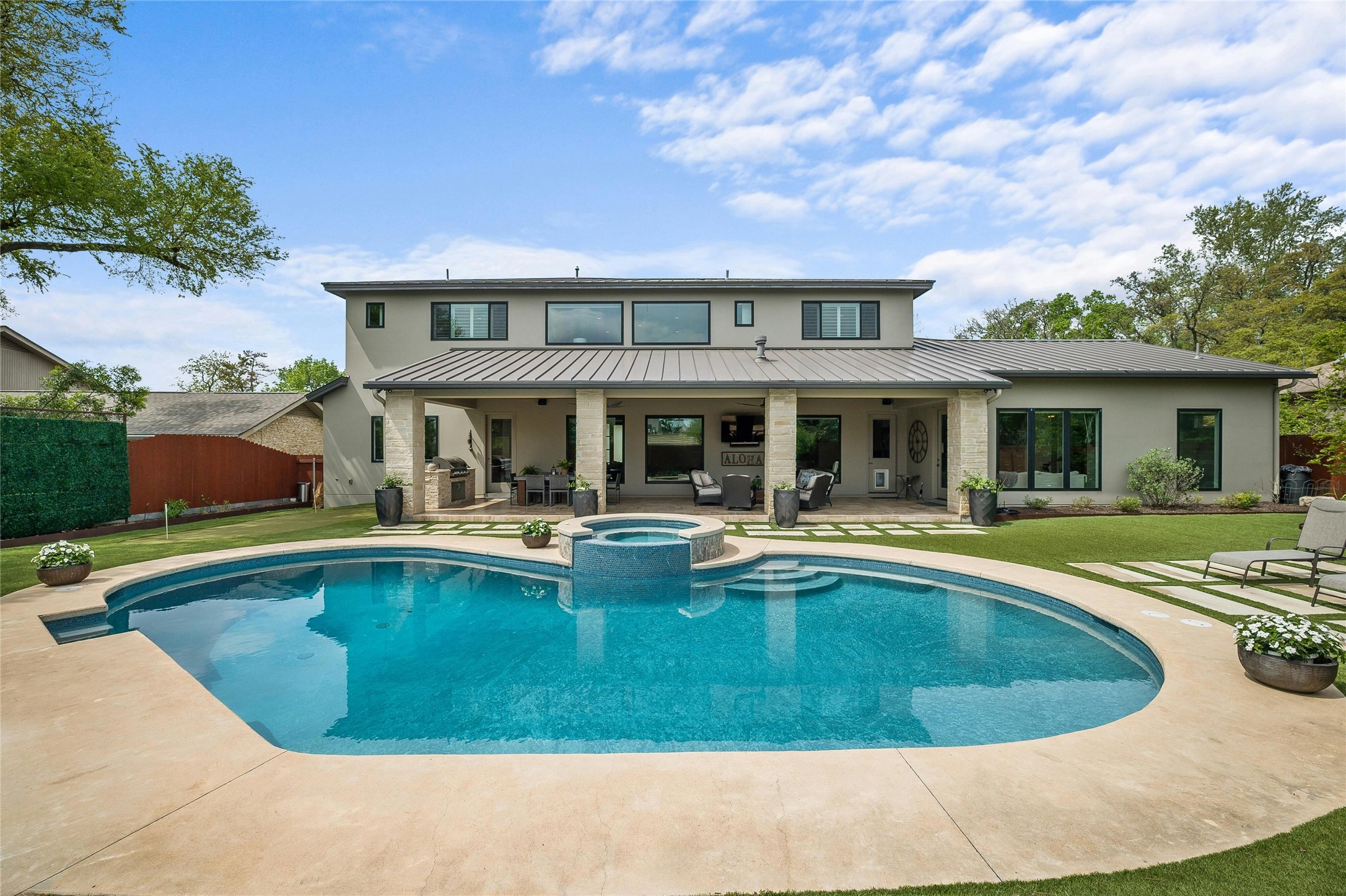 2201 Cypress Point West Austin, TX 78746 - Photo 12 of 37 a view of a house with swimming pool and sitting area