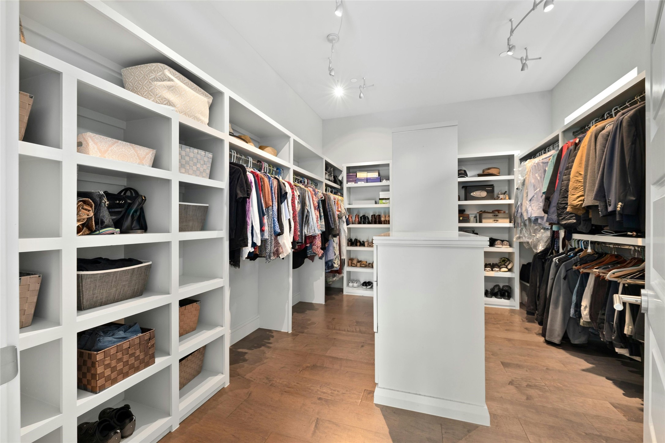 2201 Cypress Point West Austin, TX 78746 - Photo 17 of 37 a view of walk in closet with clothes and shoes