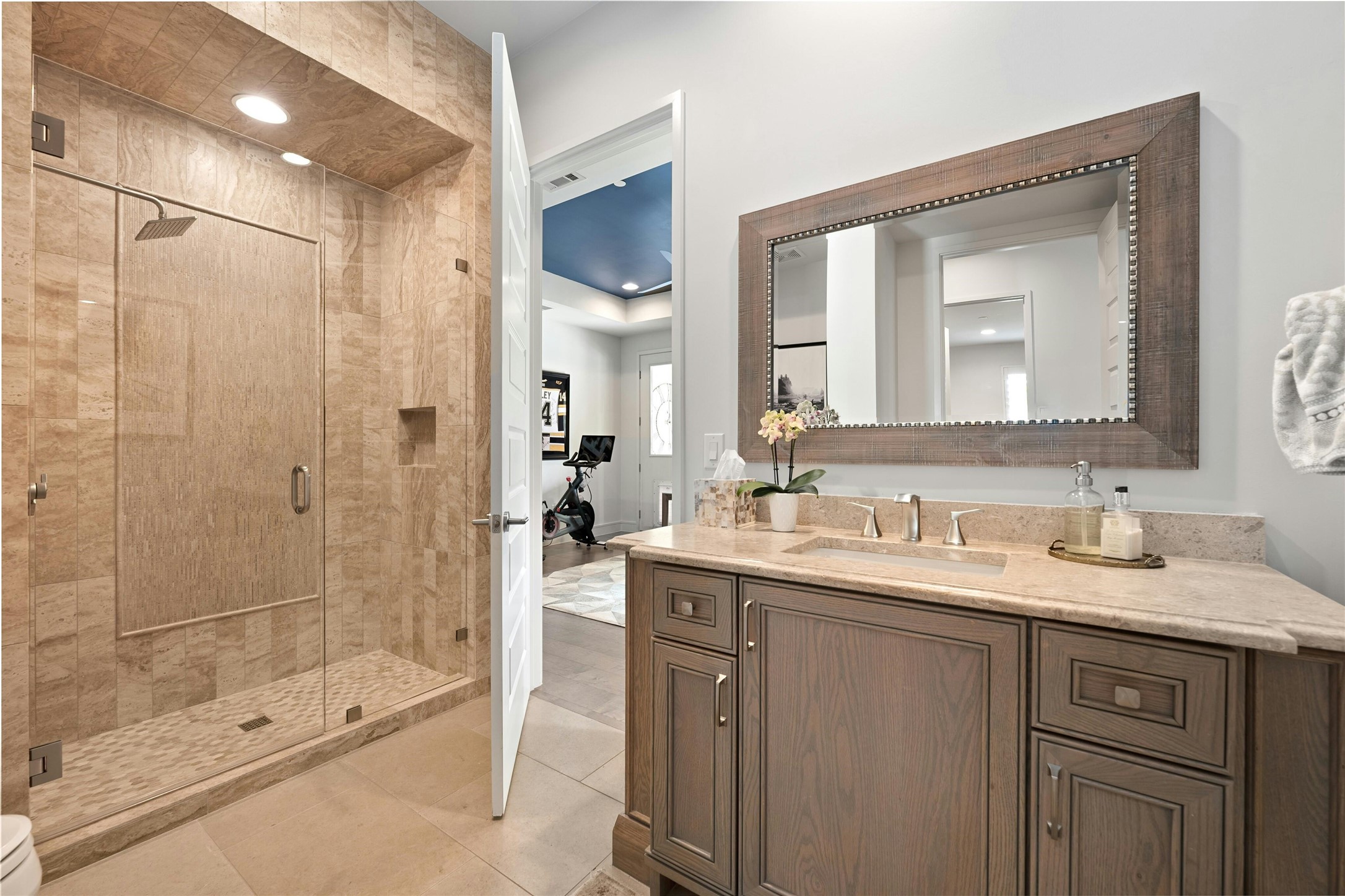 2201 Cypress Point West Austin, TX 78746 - Photo 19 of 37 a bathroom with a shower sink vanity and mirror