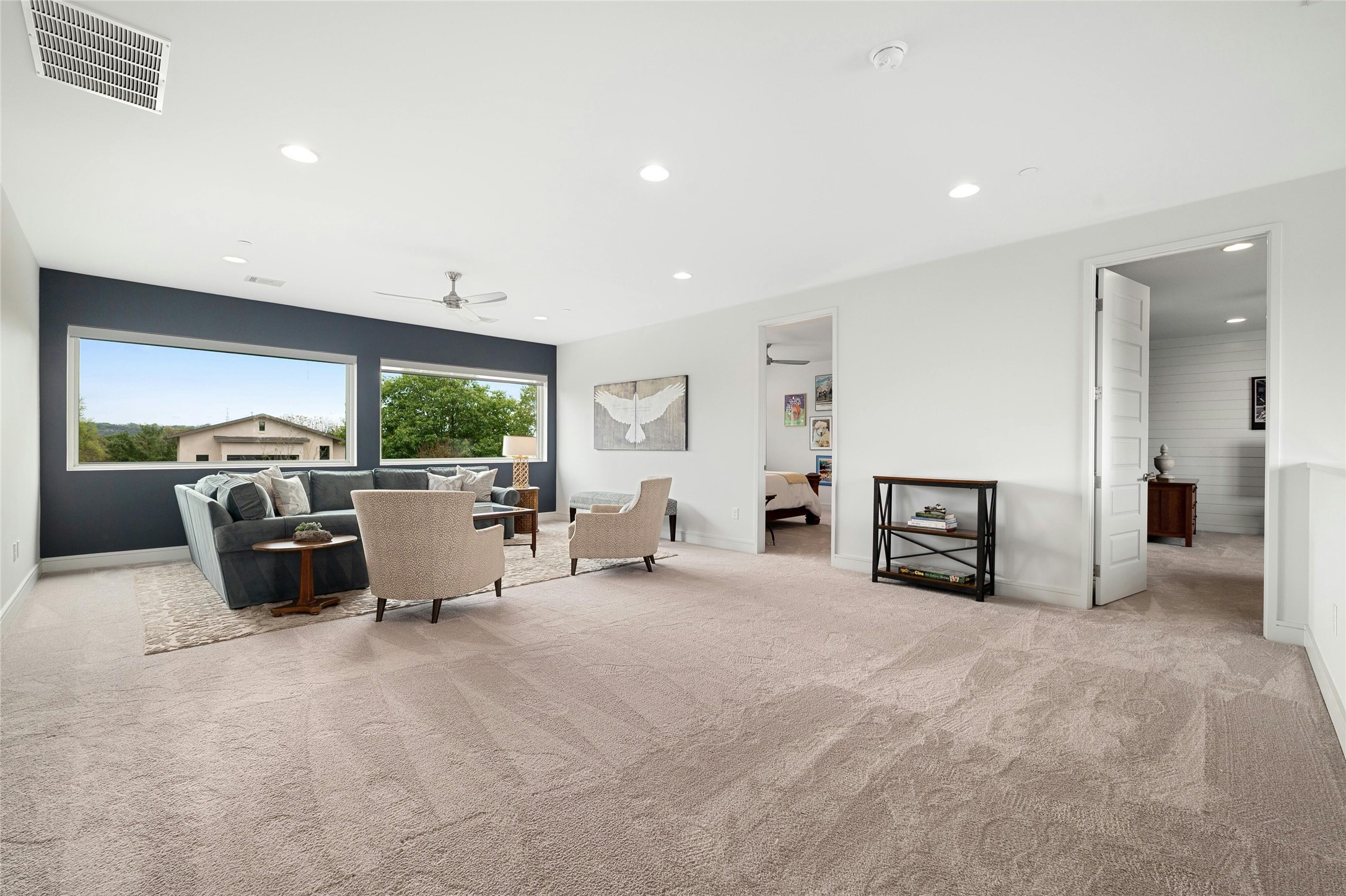 2201 Cypress Point West Austin, TX 78746 - Photo 23 of 37 a view of a livingroom with furniture and a flat screen tv