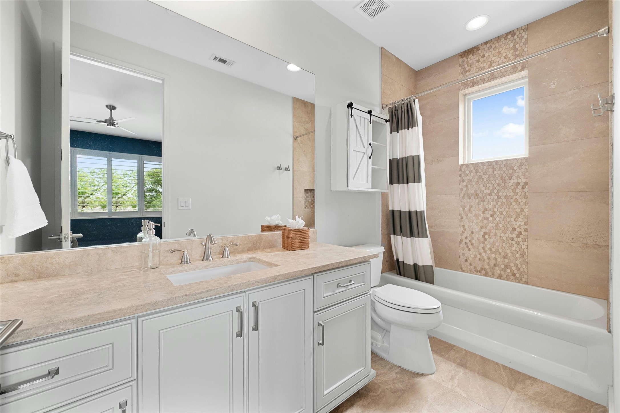 2201 Cypress Point West Austin, TX 78746 - Photo 25 of 37 a bathroom with a granite countertop sink a toilet and shower