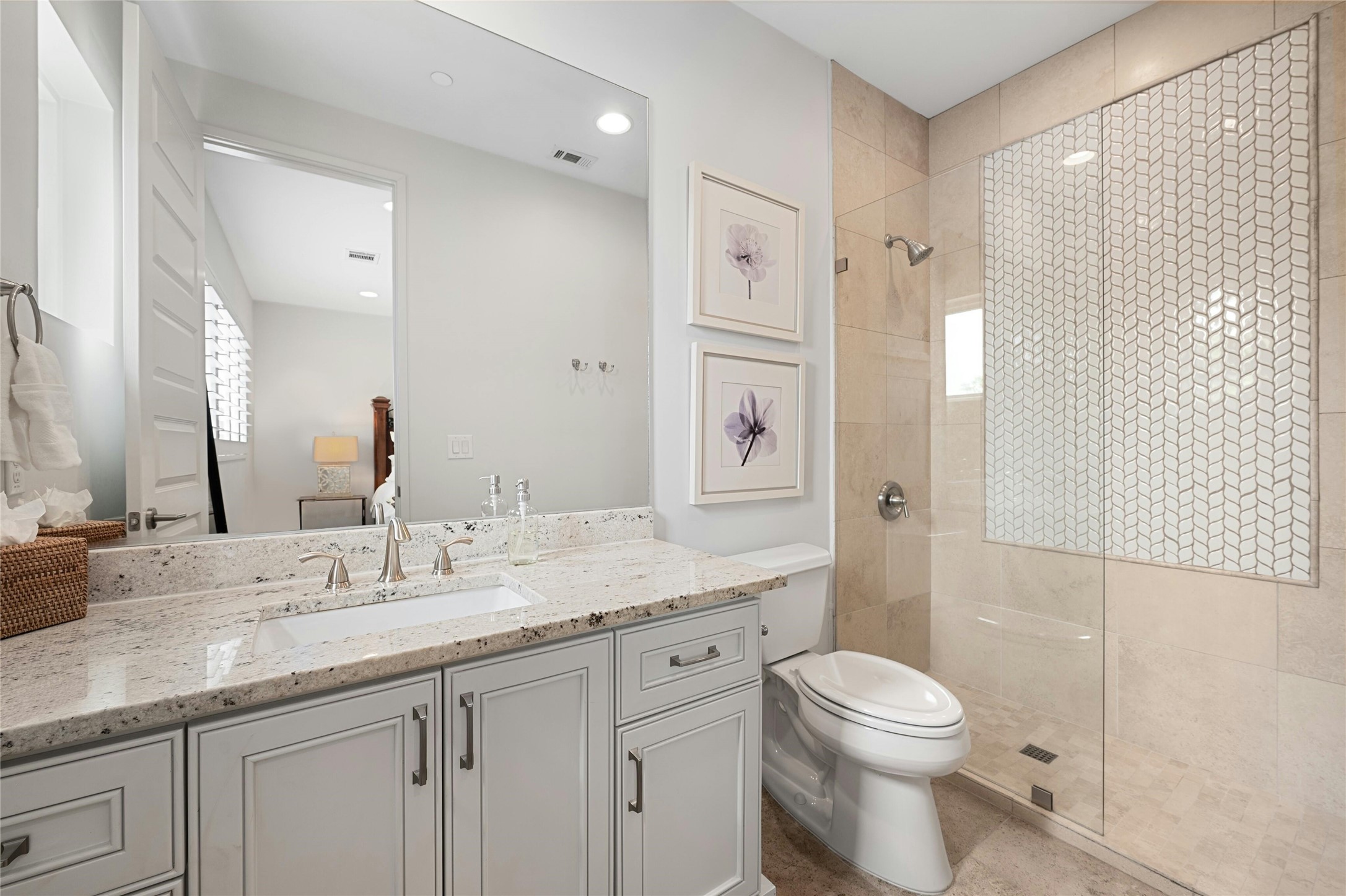 2201 Cypress Point West Austin, TX 78746 - Photo 27 of 37 a bathroom with a granite countertop sink a toilet and shower