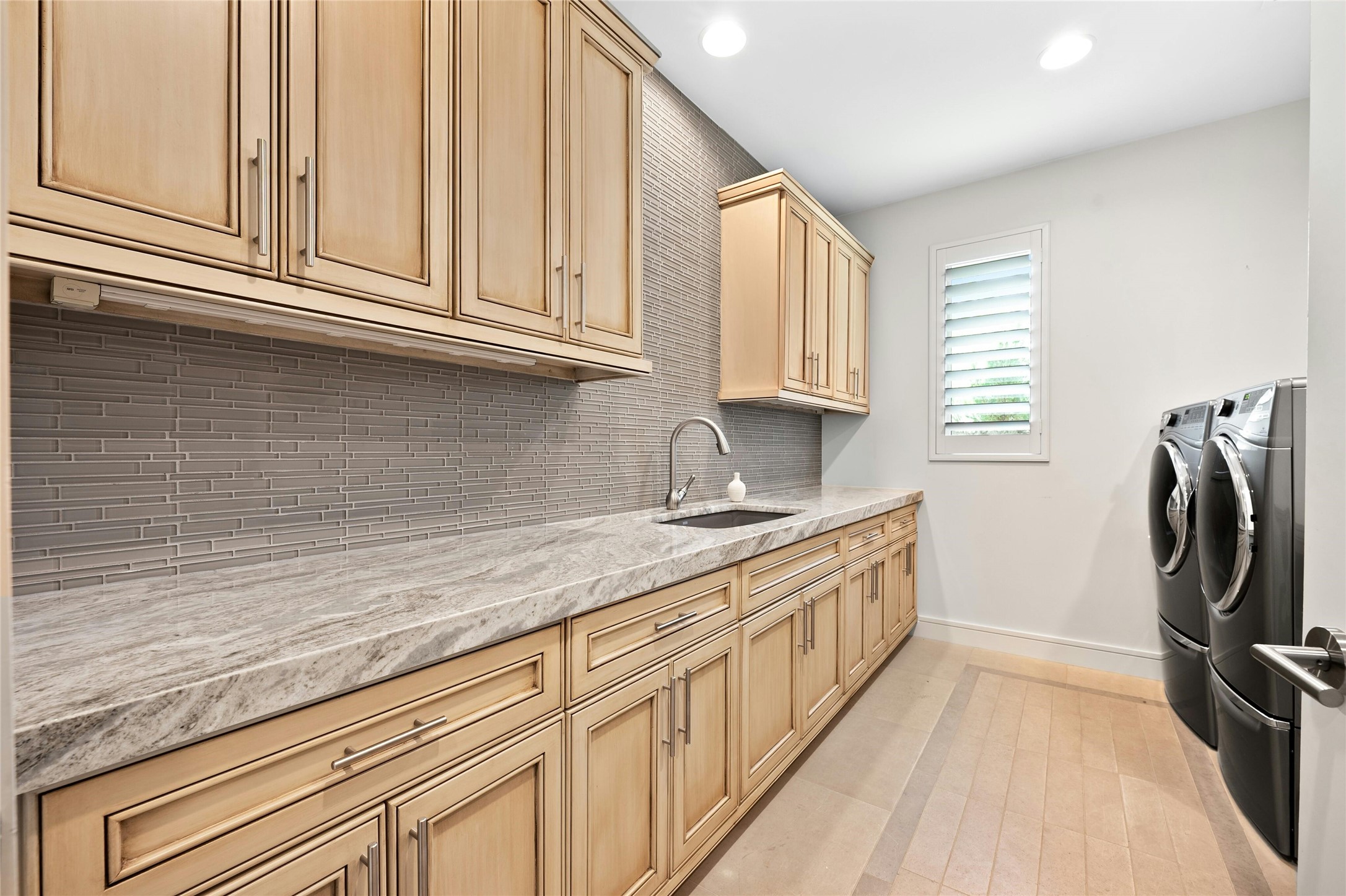 2201 Cypress Point West Austin, TX 78746 - Photo 31 of 37 a kitchen with stainless steel appliances granite countertop a sink a stove and a refrigerator