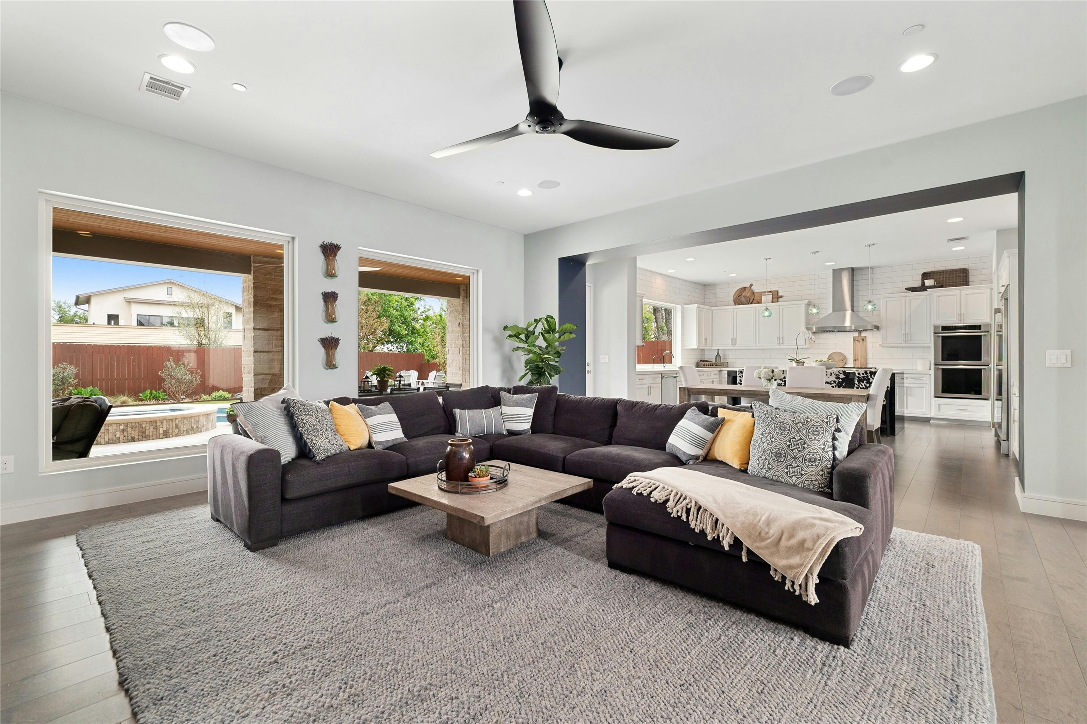 2201 Cypress Point West Austin, TX 78746 - Photo 6 of 37 a living room with furniture and a large window