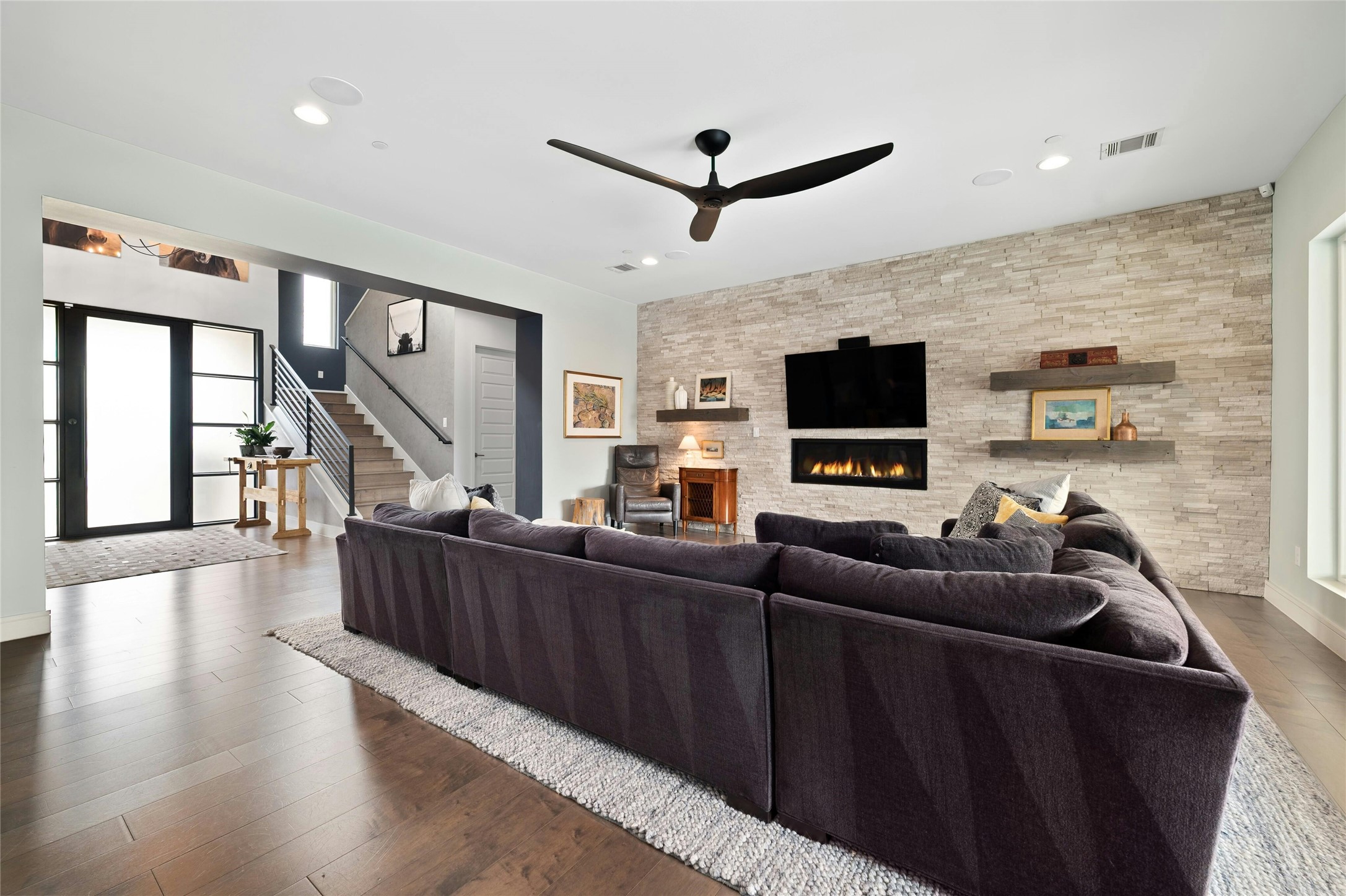 2201 Cypress Point West Austin, TX 78746 - Photo 7 of 37 a living room with furniture and a flat screen tv